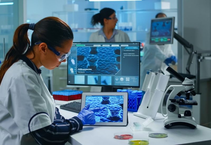 lab-technician-doctor-analyzing-virus-evolution-looking-digital-tablet-team-scientists-conducting-vaccine-development-using-high-tech-researching-treatment-against-covid19-pandemic (1)